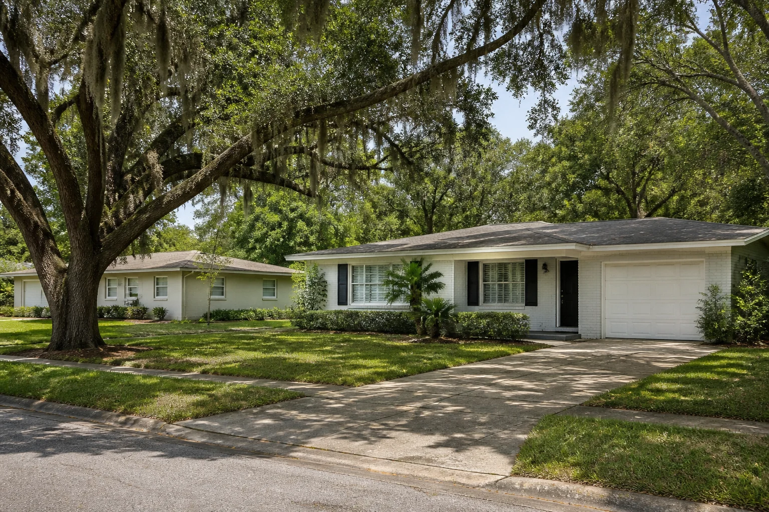 Everyday Florida homes with practical pitched roofs and mature landscaping