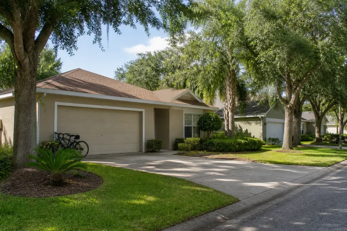 Everyday Florida homes with practical pitched roofs and mature landscaping