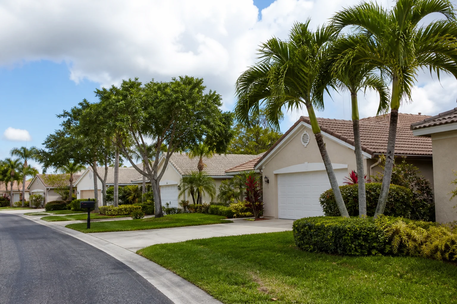 Everyday Florida homes with practical pitched roofs and mature landscaping