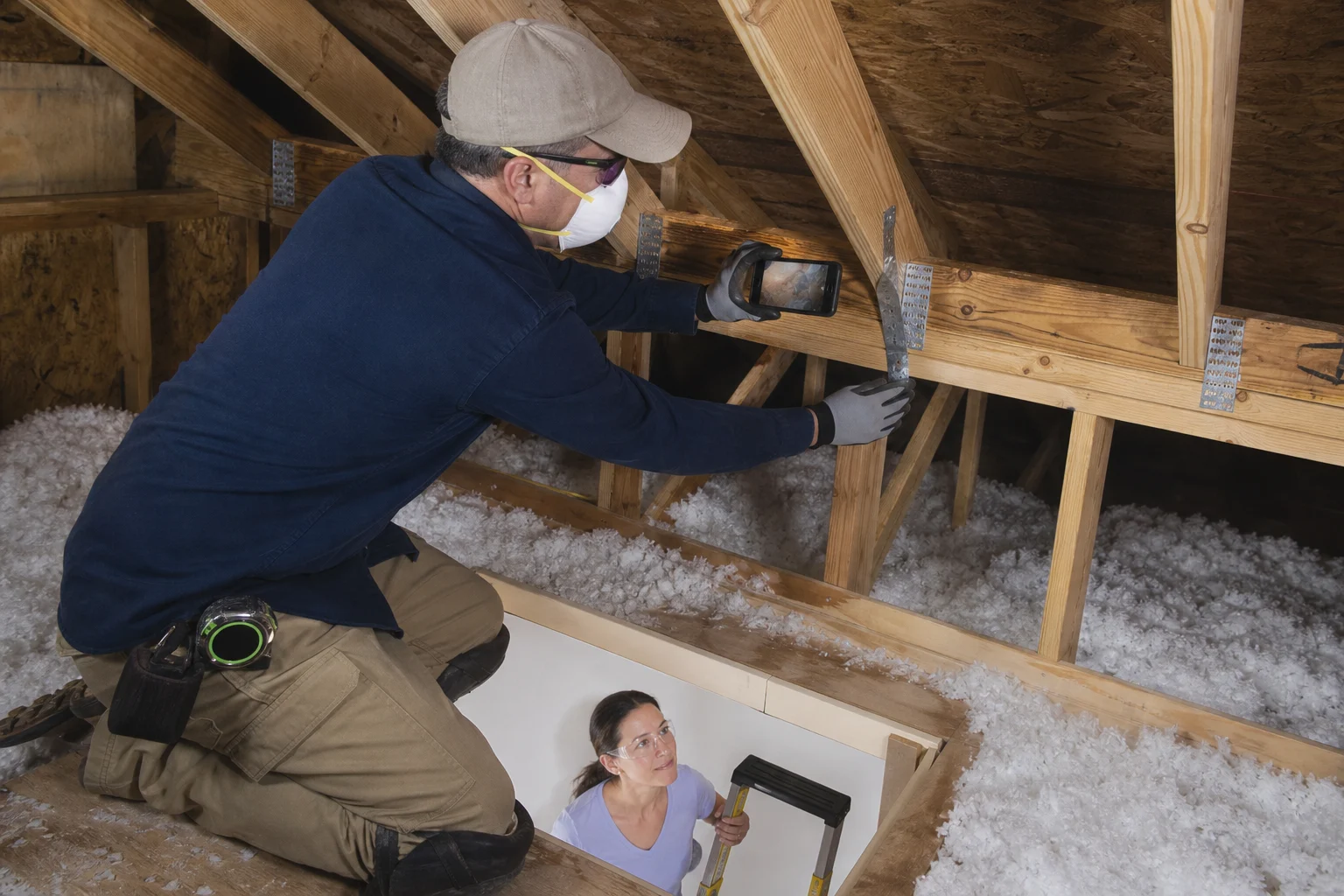 Inspector checking visible wind-mitigation features at a Florida home.
